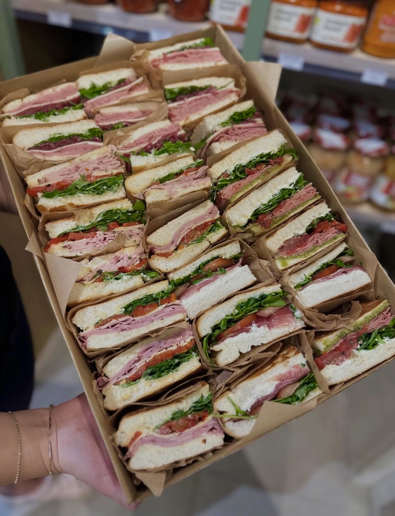 A Miro's Deli sandwich box filled with assorted focaccia sandwiches