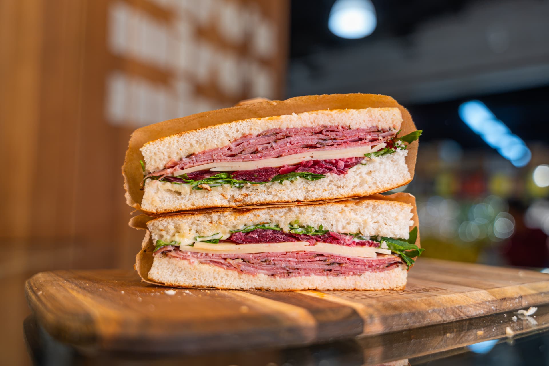 The Deli Classic focaccia sandwich stacked and wrapped.